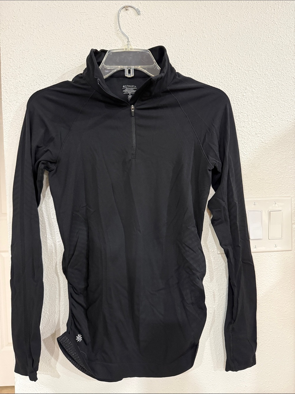 Athleta Women’s quarter-zip workout top.